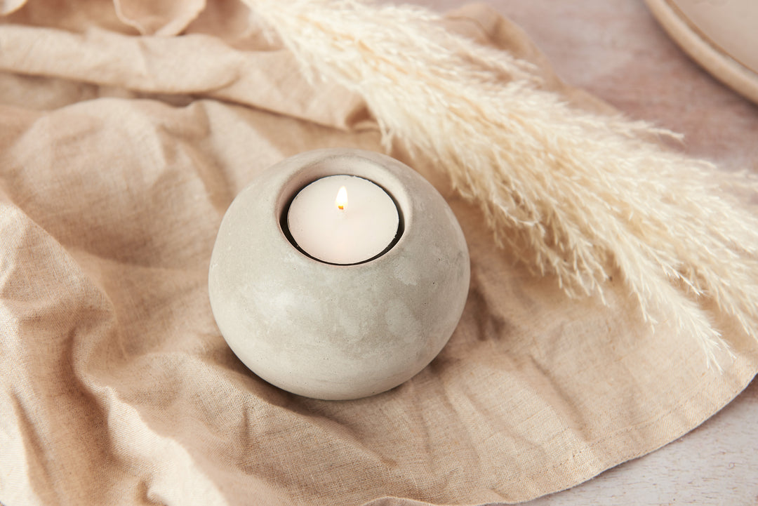 Spherical concrete tea light holder