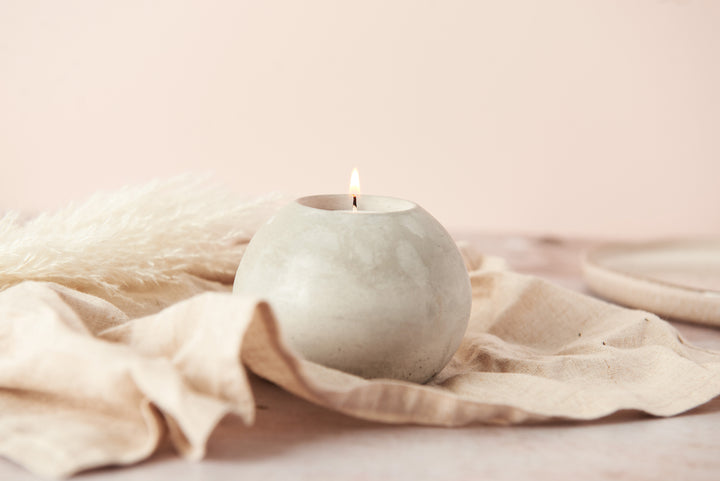 Spherical concrete tea light holder