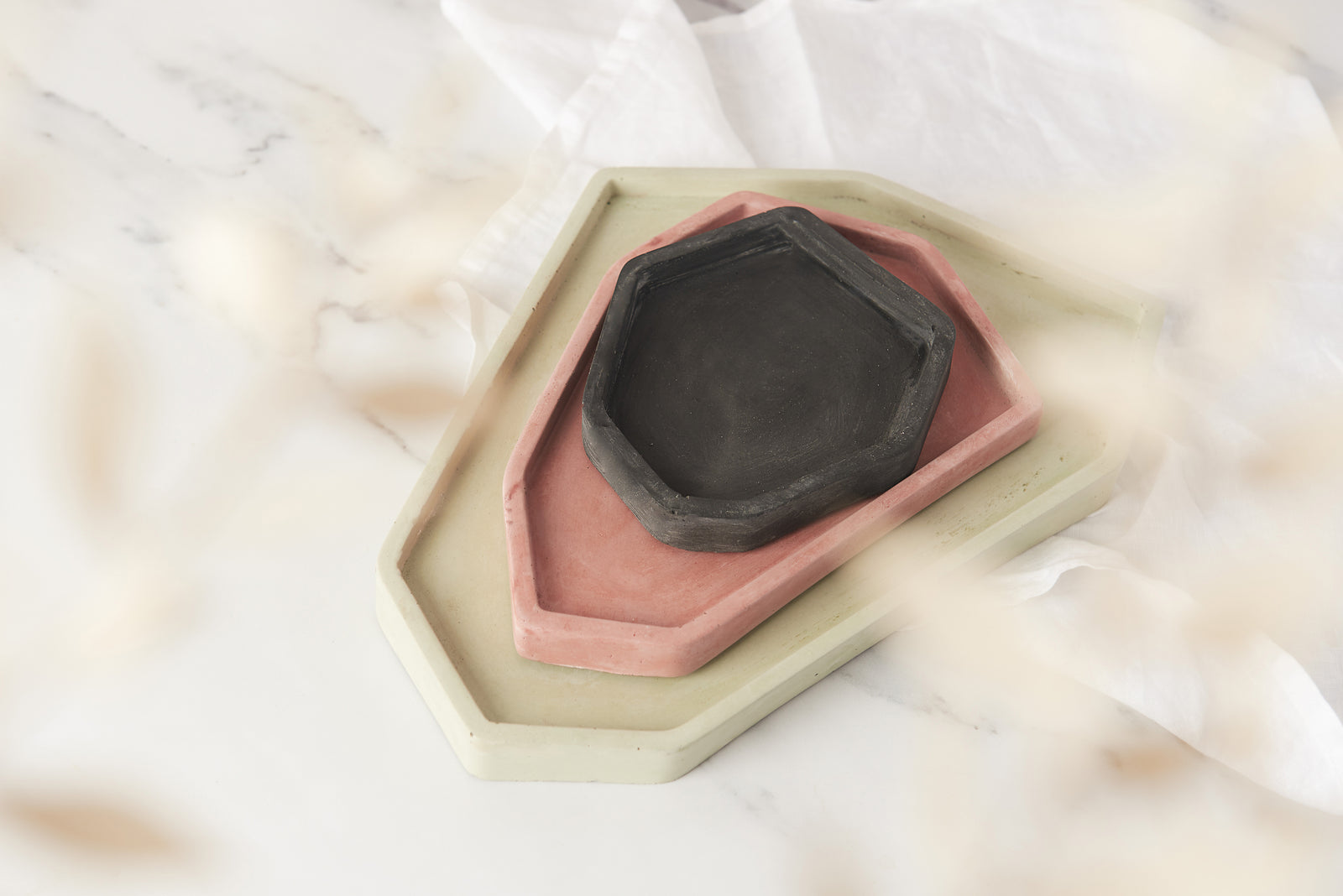 A picture of 3 concrete trays